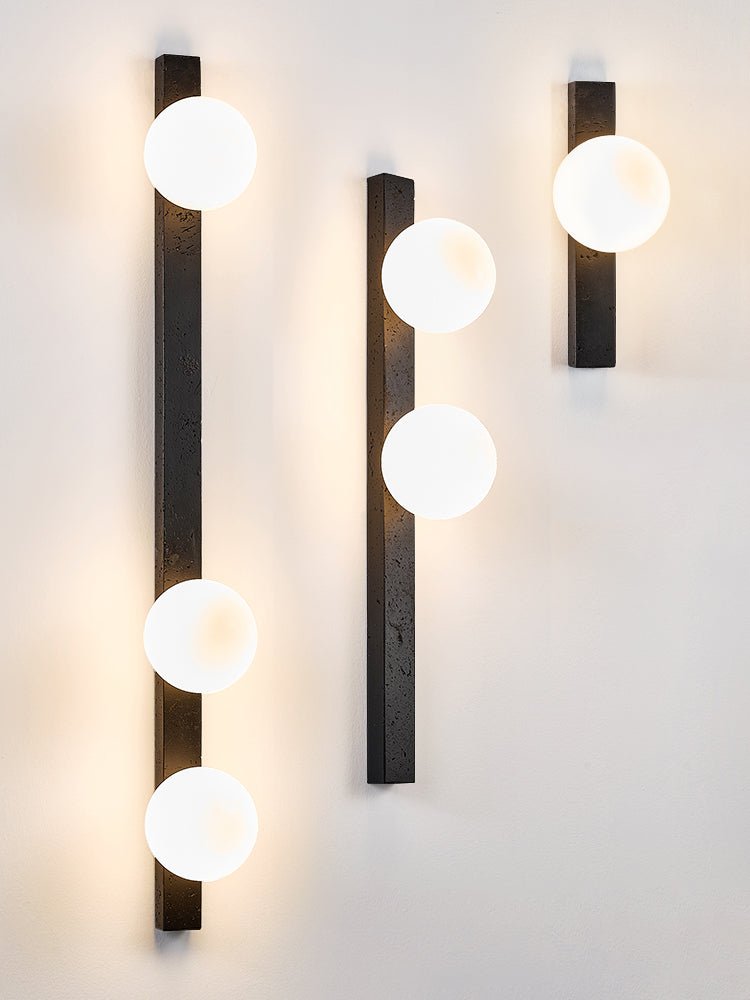Zoshaira Globe Black Travertine Wall Sconce