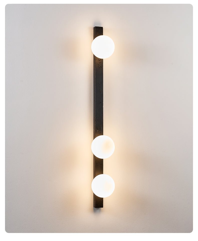 Zoshaira Globe Black Travertine Wall Sconce