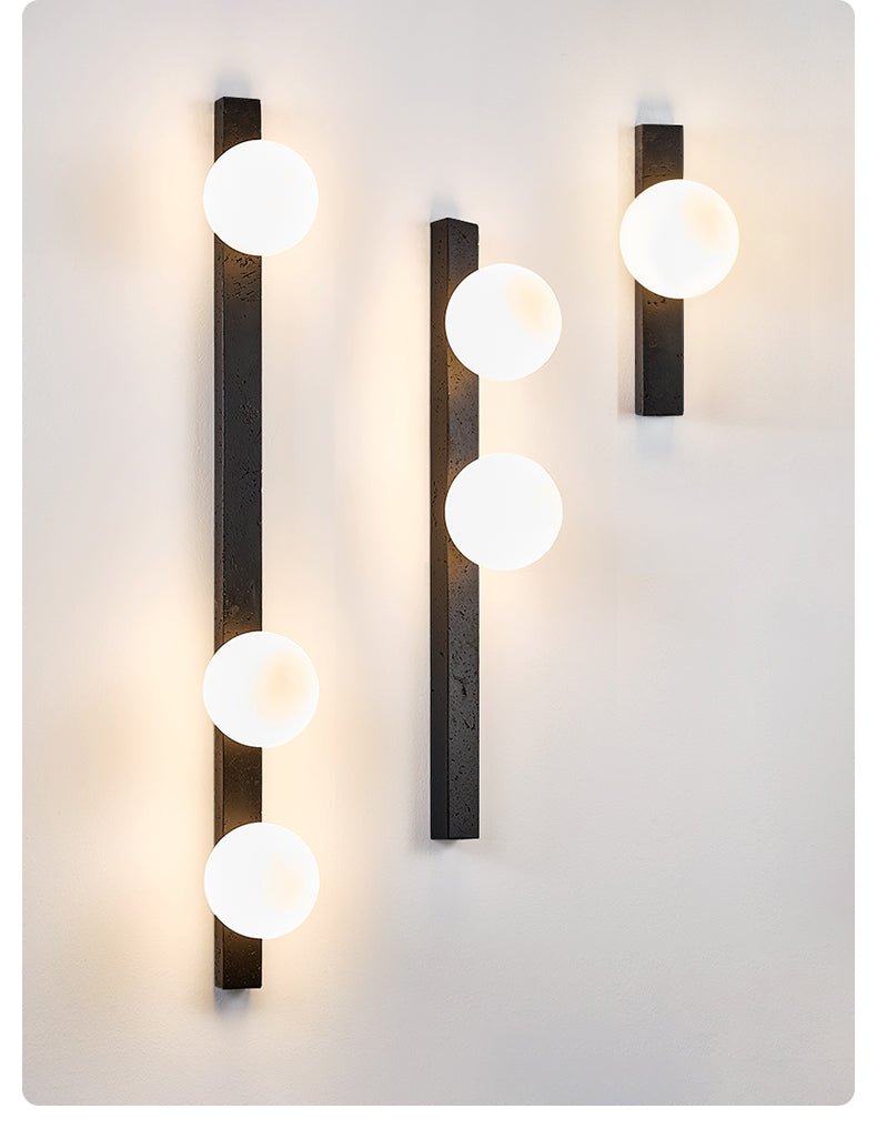 Zoshaira Globe Black Travertine Wall Sconce