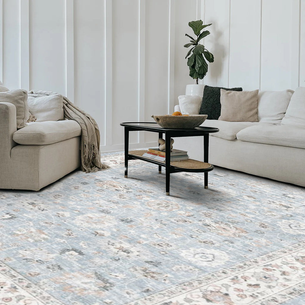 Light blue washable Persian rug with floral pattern in a modern living room, washable rugs
