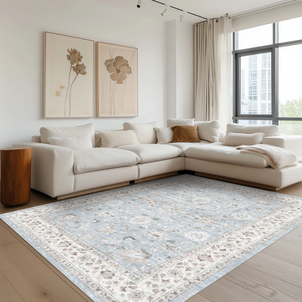 Light blue washable Persian rug in a modern living room setting. Featuring floral patterns and durable design.