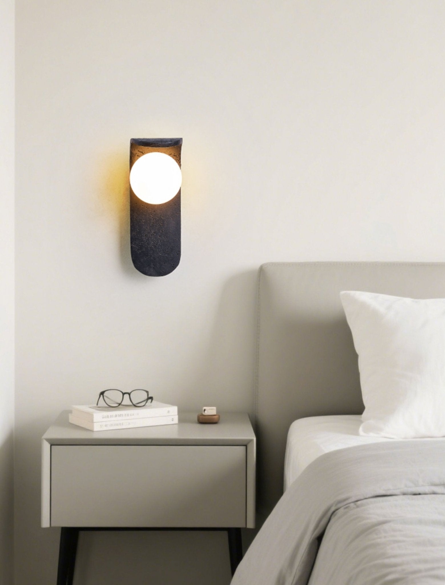 Serelora Black Travertine Orb Wall Sconce