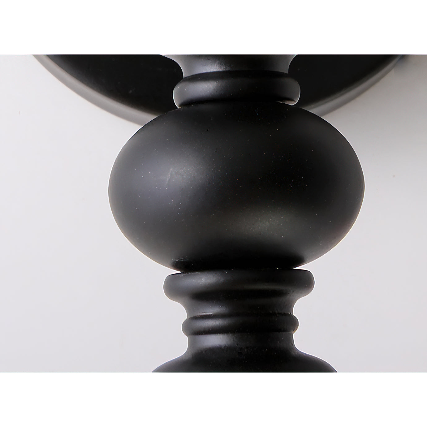 Sienna Candle Wall Sconce in orange finish, detail of the finish.