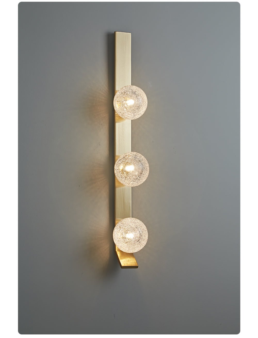 Teriivelle Vertical Orb Wall Sconce