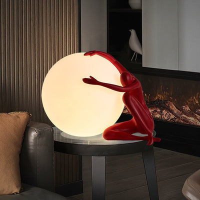 Cosmo Humanoid Ball Holding Table Lamp