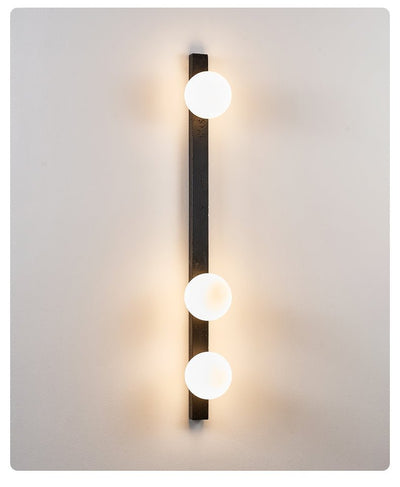 Zoshaira Globe Black Travertine  Wall Sconce