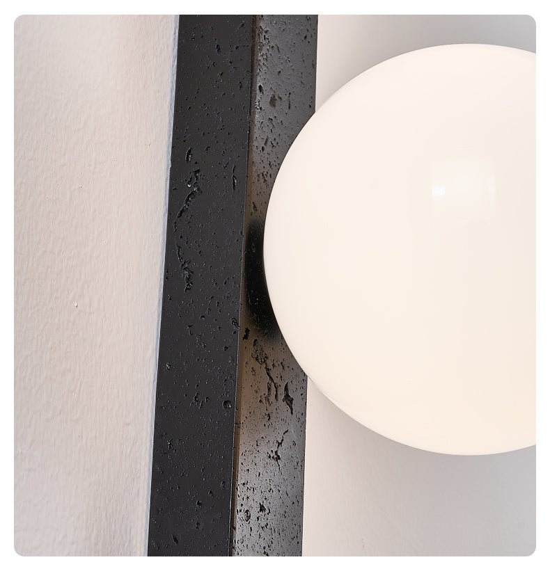 Zoshaira Globe Black Travertine  Wall Sconce