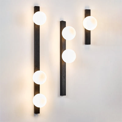 Zoshaira Globe Black Travertine  Wall Sconce