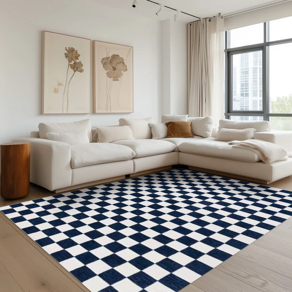 Navy and white checkered washable area rug in modern living room setting
