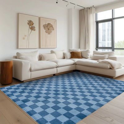 Blue checkered Tiberius washable area rug in a modern living room setting.