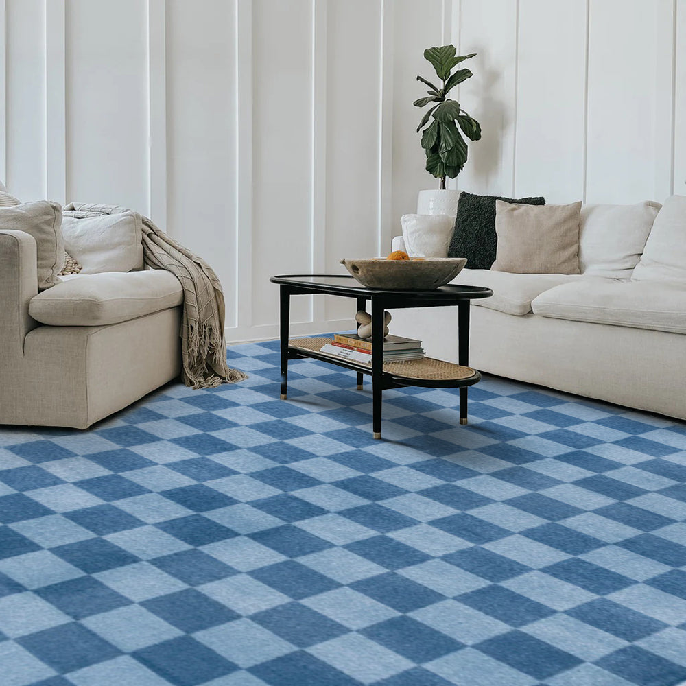Blue checkered Tiberius washable area rug in a modern living room setting, showcasing modern living room furniture.