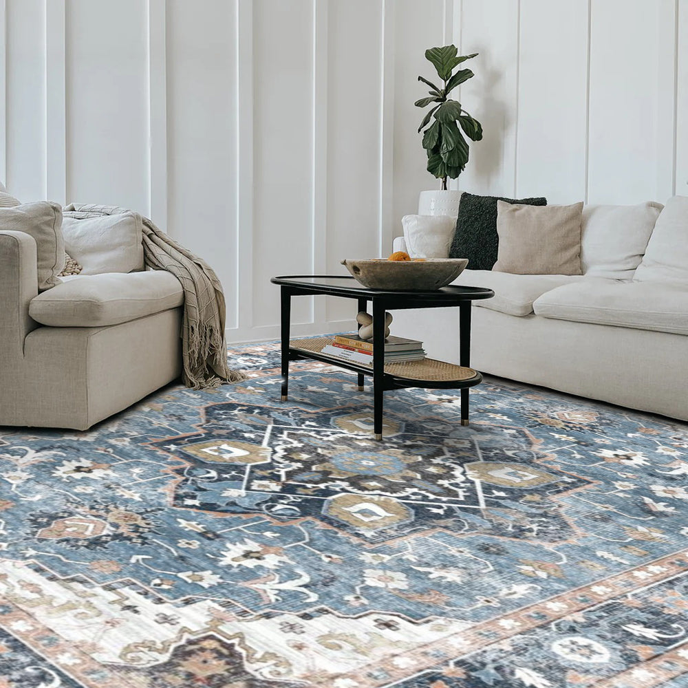 Astraea blue vintage washable rug in living room. Power-Loomed, 100% Polyester. Part of the washable rugs collection.