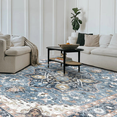 Astraea blue vintage washable rug in living room. Power-Loomed, 100% Polyester. Part of the washable rugs collection.
