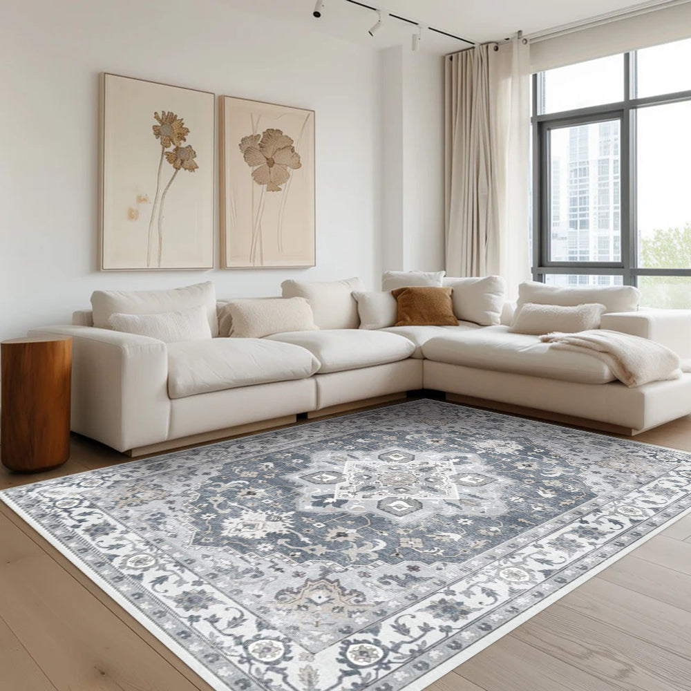 Aurelius washable rug in a living room. Gray and blue floral pattern, perfect for modern decor.