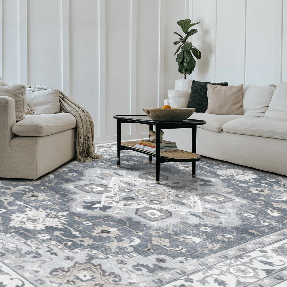 Aurelius Vintage Washable Rug in a living room setting, featuring intricate gray and blue patterns, perfect for modern decor.