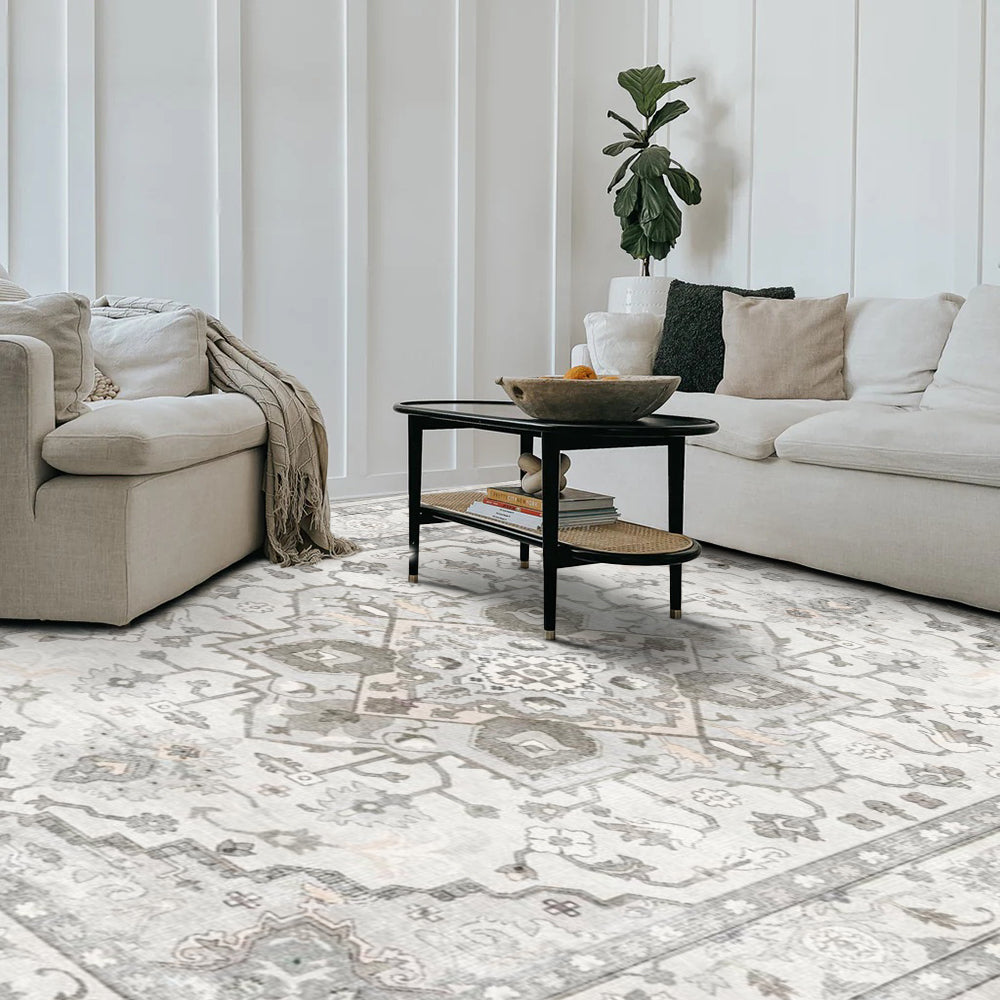 Bellerose Vintage Washable Rug in a modern living room setting, showcasing floral pattern and grey and off-white colors.
