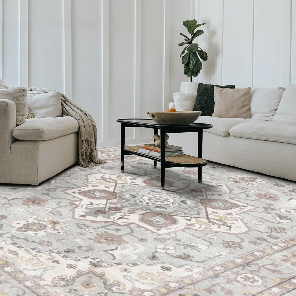 Celandine Vintage Washable Rug in a modern living room. Gray and brown patterned area rug with sofa and coffee table.