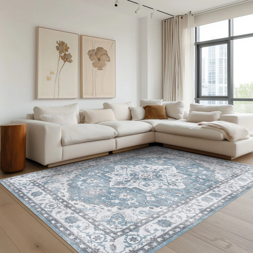 Eldora vintage washable rug in a modern living room setting, featuring a detailed blue and gray pattern.