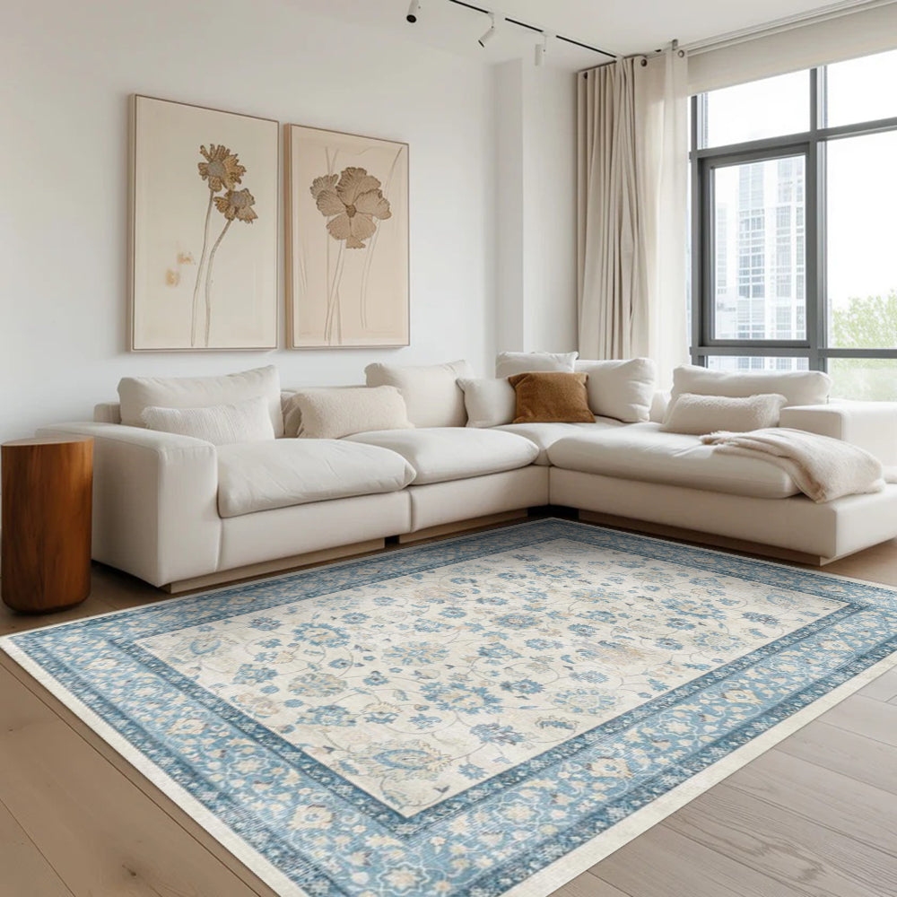 Eleutheria Vintage Washable Rug, blue floral design in a living room setting, washable area rug.