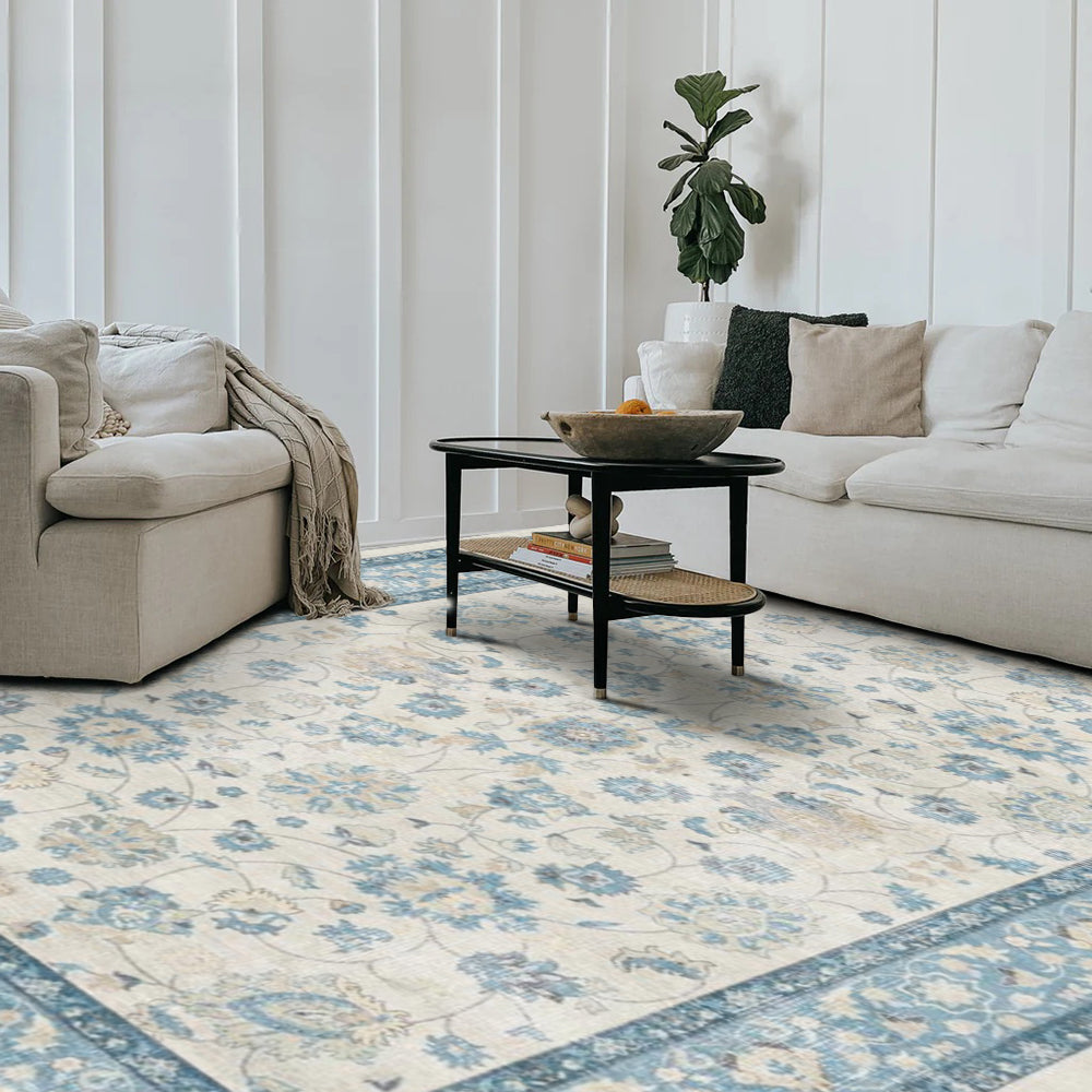 Eleutheria Vintage Washable Rug in a living room setting, blue floral design, washable area rug.