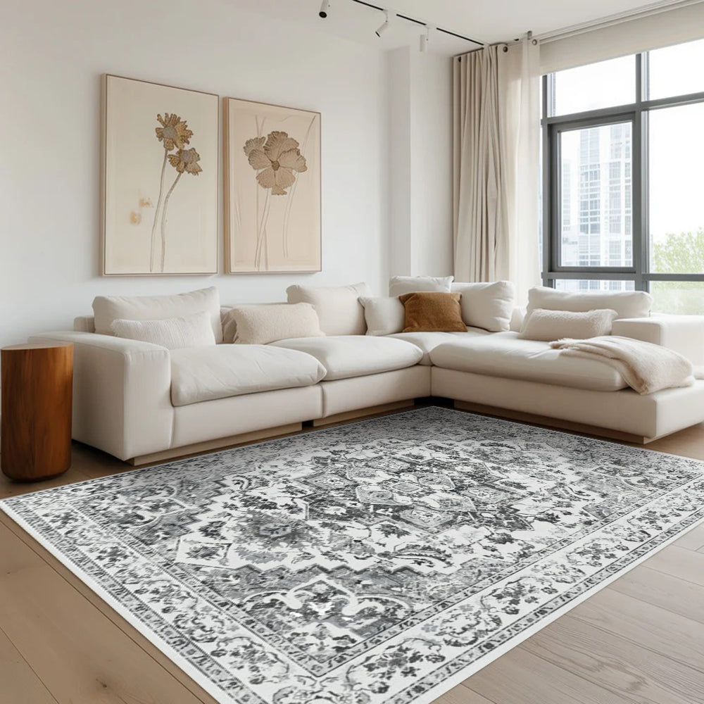 Endymion Vintage Washable Rug in living room setting, gray and white floral pattern, power-loomed area rug