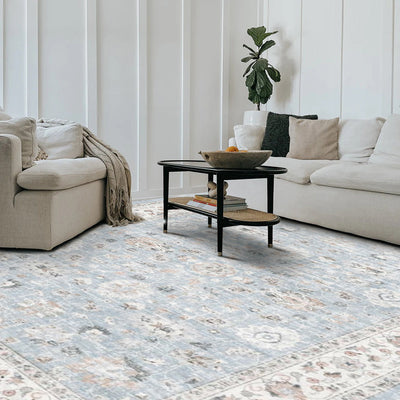 Light blue washable Persian rug with floral pattern in a modern living room, washable rugs