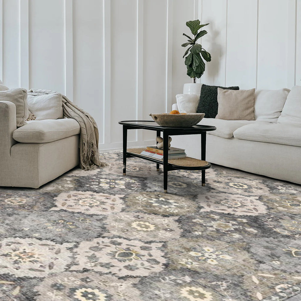 Storm Persian washable rug in a living room setting. Gray and beige floral pattern area rug with non-slip design.