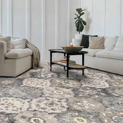 Storm Persian washable rug in a living room setting. Gray and beige floral pattern area rug with non-slip design.