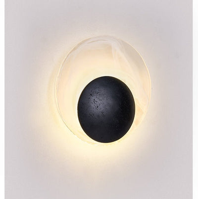 Orla Cosmica Eclipse Black Travertine Shell Wall Lamp