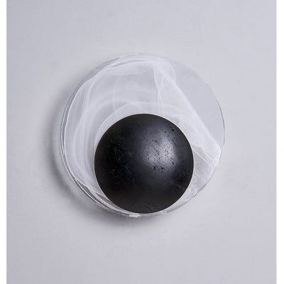 Orla Cosmica Eclipse Black Travertine Shell Wall Lamp