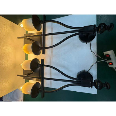 The Sienna Sconce configured with a glass lampshade.