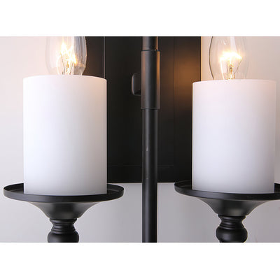 Sienna Candle Wall Sconce in white finish, lit.