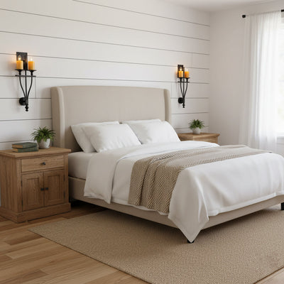 The Sienna Wall Sconce installed in a modern living room setting.