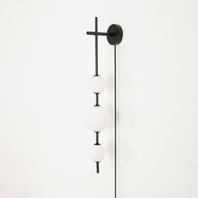Ilraeia Vertical Globe Plug-in Wall Lamp