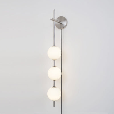 Ilraeia Vertical Globe Plug-in Wall Lamp